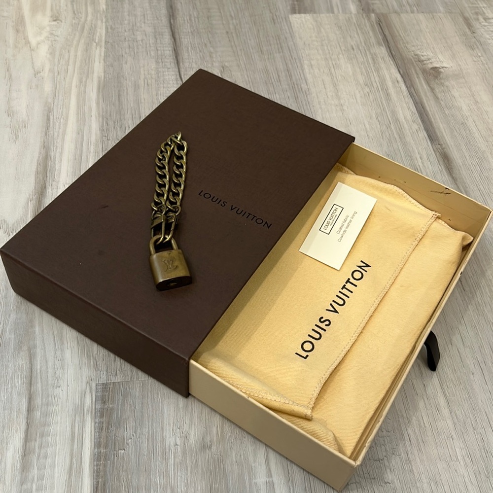 Louis Vuitton 326 lock and bracelet with  no key.  BOX and DUST BAG included!!